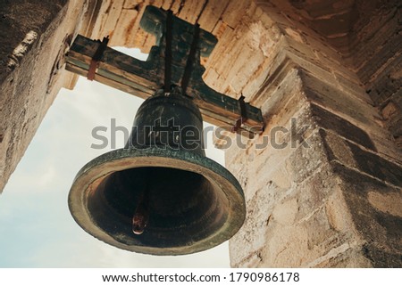 Bell in steeple on top of a village in Andalusia, Spain.
