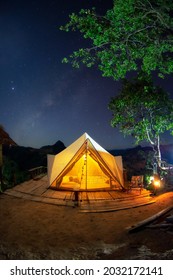 Bell Tent Camping White In The Midst Of Nature And The Milky Way At Night.