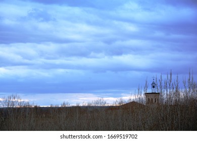 the bell tower behind the trees