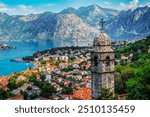 Bell tower of Church Our Lady of Remedy on the hill tower in the old city of Kotor and the Kotor Bay in Montenegro. Travel and vacation theme