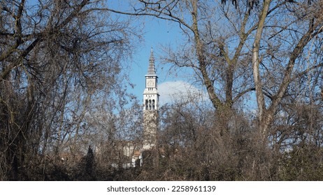 Bell tower of the church of Ponte San Pietro, seen from the countryside. Bergamo province. Winter season - Shutterstock ID 2258961139