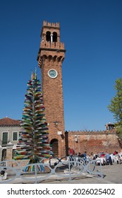 Bell Tower And Murano Glass Tree Sculpture In Murano In Venice,Italy,2019,march