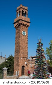 Bell Tower And Murano Glass Tree Sculpture In Murano In Venice,Italy,2019,march