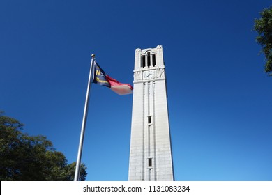 The Bell Tower And North Carolina State Flag On The Campus Of NC State University 