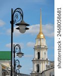 Bell tower of the Transfiguration Cathedral in Rybinsk and beautiful street lights