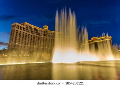 Bellagio and Caesars Palace at dusk with illuminated fountains, The Strip, Las Vegas, Nevada, USA 03.01.14