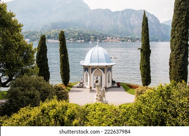 BELLAGIO MAY 14, 2014: Close up of a white romantic Italian wedding chapel with the lake and mountains in the background taken on May 14, 2014 in Bellagio, Italy