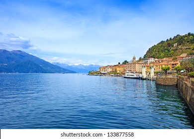 Bellagio town in Como lake district. Landscape with marina and italian traditional lake village. On background Alps mountains covered by snow. Lombardy region, Italy, Europe.