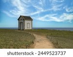 Belle-Ile in Brittany, small building on the cliffs at the Cote Sauvage, the foghorn house