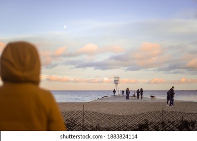 Bellevue Strand, Copenhagen - 12 25 2020: Sunset Scene On The Danish Coast Beach With Beach Tower And People