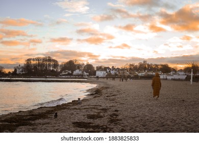 Bellevue Strand, Copenhagen - 12 25 2020: Sunset Scene On The Danish Coast Beach With Beach Tower And People