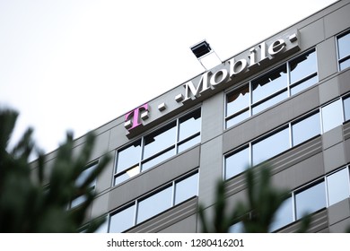 Bellevue, Washington / USA - January 3 2019: Low Angle View On The T Mobile Logo Atop The Headquarters Building, Framed By Trees. With Space For Text On Top And Bottom