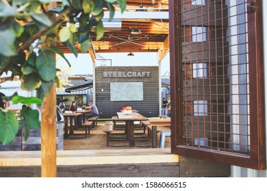 Bellflower, California/United States - 11/09/2019: A View Through One Of The Exterior Windows To The Neon Steelcraft Sign