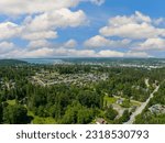 Bellingham Washington City Aerial View from Yew Street Houses Sit Amongst Grren Trees With a View of Bay Waterfront Area