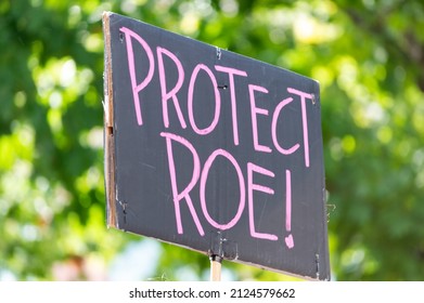 BELLINGHAM, WASHINGTON, USA - October 2, 2021: A hand holding a sign supporting the protection of Roe v. Wade during a rally for abortion justice.
