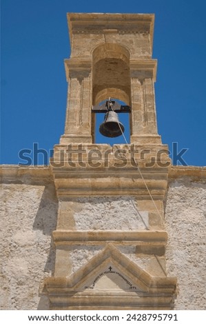 The belltower of the monastery of the virgin of the golden step at hrissoskalitissa on the coast of western crete, greek islands, greece, europe