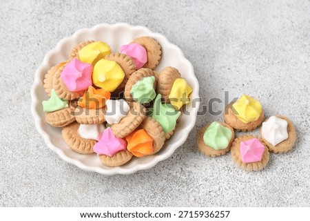 Belly button iced gem biscuits. Small round biscuits with colorful candy on top, usually this old school food is widely available when the holidays arrive.