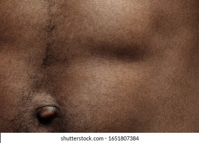 Belly. Detailed Texture Of Human Skin. Close Up Shot Of Young African-american Male Body. Skincare, Bodycare, Healthcare, Hygiene And Medicine Concept. Looks Beauty And Well-kept. Dermatology.