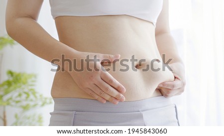 Belly of a fat Asian woman