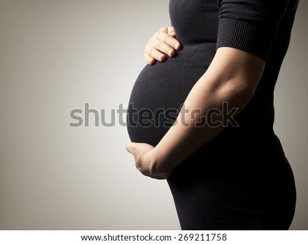 Similar – Image, Stock Photo Pregnant woman holding her tummy