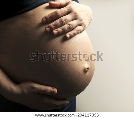 Similar – Image, Stock Photo Pregnant woman holding her tummy