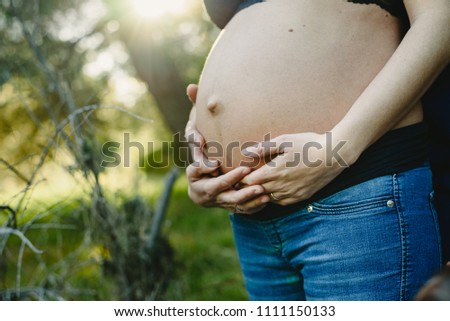 Similar – Foto Bild Schwangere Frau, die ihren Bauch streichelt.