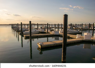 Belmar, NJ, USA -- May 3, 2015 -- A wide angle photo taken at dusk,  of boats docked at the Belmar, NJ Marina.