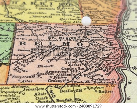 Belmont County, Ohio marked by a white tack on a colorful vintage map. The county seat is located in the city of St. Clairsville, OH.