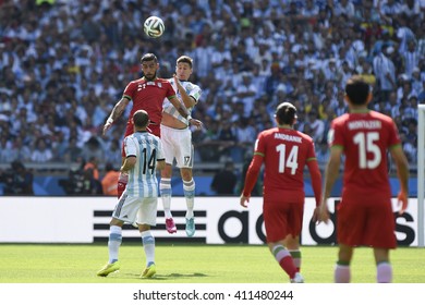 Belo Horizonte, Brazil - June 21, 2014: Ashkan DEJAGAH Of Iran And Federico FERNANDEZ Of Argentina During The FIFA 2014 World Cup. Argentina Is Facing Iran In The Group F At Minerao Stadium