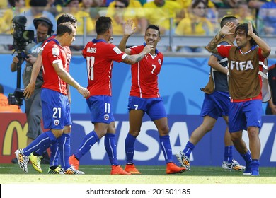 BELO HORIZONTE, BRAZIL - June 28, 2014: Alexis Sanchez of Chile celebrates his goal during the 2014 World Cup Round of 16 game between Brazil and Chile at Mineirao Stadium. NO USE IN BRAZIL.