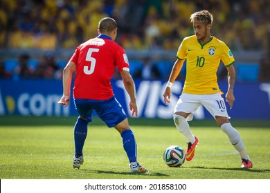 BELO HORIZONTE, BRAZIL - June 28, 2014: Neymar of Brazil competes for the ball during the World Cup Round of 16 game between Brazil and Chile at Mineirao Stadium. No Use in Brazil.