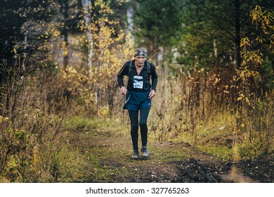 Beloretsk, Russia -  September 26, 2015: Very Old Man Athlete Running In Autumn Forest During Marathon Mountain 