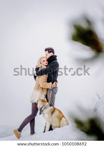Beloved couple embracing each other on the hill
