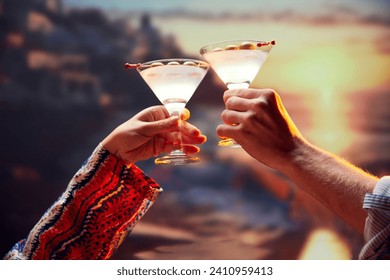 Beloved couple sitting at sunset and drinking cocktails sitting on beach. Honeymoon for newlyweds. Tourism and relax. Concept of Valentines day, alcohol drinks, date, romantic, vacation. - Powered by Shutterstock