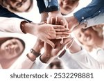 Below, business people or hand stack in office for trust, synergy or positive reinforcement. Teamwork, colleagues or gesture in workplace for cooperation, agreement or corporate project collaboration