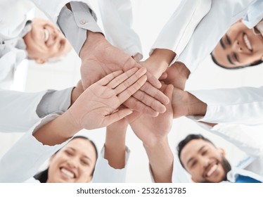 Below, hand stack and staff as doctors in hospital for teamwork, medical support and partnership circle. People, smile and diversity for team building, healthcare service and synergy of collaboration