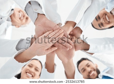 Below, hand stack and staff as doctors in hospital for teamwork, medical support and partnership circle. People, smile and diversity for team building, healthcare service and synergy of collaboration