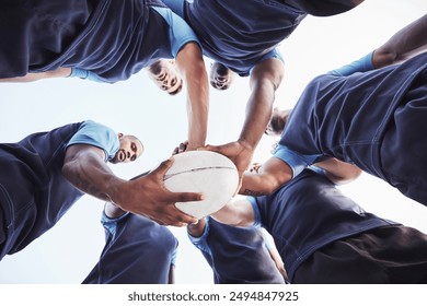 Below, hands and rugby players with ball, training and support for game, competition and fitness. Closeup, people and athlete with diversity, huddle and teamwork with practice session and challenge