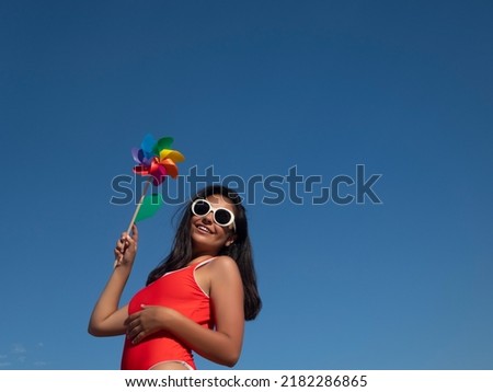 Windmill against cloudless blue sky