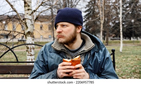 Below poverty line. Caucasian Beggar, consequences of drunkenness, alcoholism. Pauper. Illegal immigrant. Hungry bum needs help. Male tramp in dirty clothes with cap and hat. 