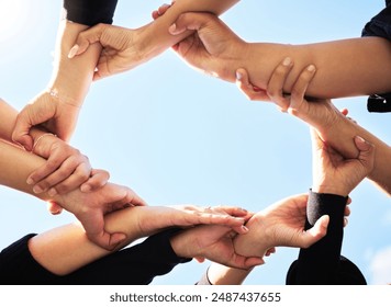 Below, team and hands in circle for support, strength and unity for synergy. Group, huddle or people connected for power, solidarity or trust in community for protest, empowerment or organization - Powered by Shutterstock