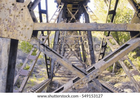 below the train tracks