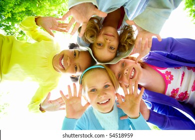 Below view of several happy girls standing head by head to each other - Shutterstock ID 54518959