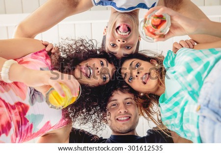 Young people with their heads together having fun