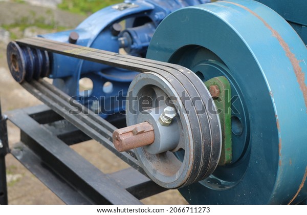 Belt drive of Diesel\
engine water pump, Pulley and belt transmission view from the\
centrifugal water pump