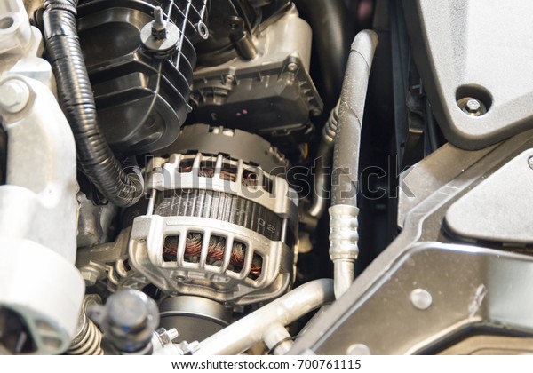 Belt\
driven power generator on the modern car engine\
