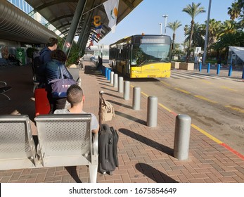 BEN GURION AIRPORT, TEL AVIV, ISRAEL. February 18, 2020. Yellow airport shuttle bus at the Ben Gurion international airport, Terminal 1. It's the terminal for low cost airlines closed for quarantine