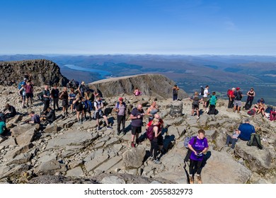 BEN NEVIS, SCOTLAND - SEPTEMBER 01 2021: Hikers On The Summer Of Ben Nevis On A Hot, Clear Day. Ben Nevis Is The Tallest Peak In The United Kingdom