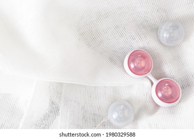 Ben Wa vaginal pleasure balls, Kegel balls on white background, top view, soft light, empty space for text