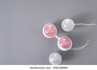 Ben Wa vaginal pleasure balls, Kegel balls on gray background, top view, soft light, empty space for text